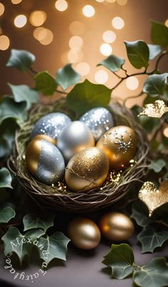 an arrangement of golden and silver ornaments in a bird's nest surrounded by ivy