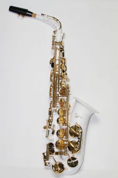 a saxophone is sitting on the ground with its mouth open