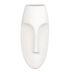 a white vase with a face on the top and bottom half is shown against a white background