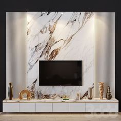 a tv is mounted on the wall in front of a white marbled entertainment center