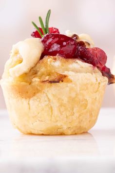 a close up of a pastry with fruit on top