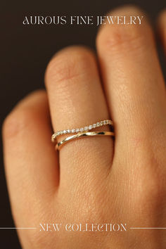 a woman's hand with a wedding ring on it and the words, aurora fine jewelry