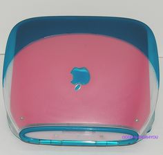 a pink and blue case with an apple logo on the back side, sitting on a white surface