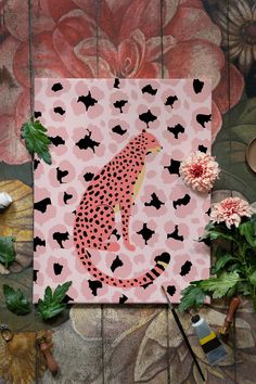 a pink and black leopard print on a wall next to some potted planters