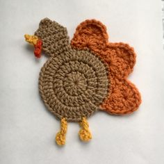 two crocheted turkeys sitting next to each other