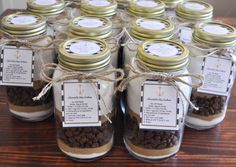 mason jars filled with chocolate chips on top of a wooden table