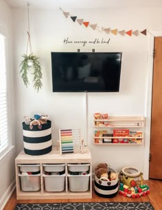 a playroom with toys and books on the wall, including baskets for children's toys