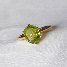 The Buyer Must Be Reads All Details About The Product . Material  14k Yellow Gold  . Gemstone  Natural Peridot  . Gemstone Colour .... Green . Gemstone Size  6x8 mm . Gemstone Shape  Oval . Birthstone  August Birthstone Peridot Band Ring, Green Oval Cabochon Emerald Ring For Wedding, Green Emerald Oval Cabochon Ring For Wedding, Green Oval Gemstone Rings, Green Oval Sapphire Ring With Center Stone, Elegant Green Oval Topaz Ring, Classic Peridot Gemstone Diamond Ring, Oval Green Gemstone Birthstone Ring, Oval May Birthstone Gemstone With Center Stone