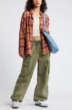 Perfect your '90s grunge aesthetic with an oversized, layer-ready button-up shirt made from lightweight plaid flannel. Front button closure Spread collar Long sleeves with button cuffs 55% cotton, 45% rayon Machine wash, tumble dry Imported Not available for sale and shipment to Germany Flannel Shirt With Cargo Pants, Oversize Flannel, 90s Flannel, 90s Grunge Aesthetic, Perfect Cosplay, Grunge Flannel, Pink Flannel, Flannel Outfits, 90s Fashion Grunge