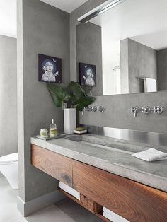 a bathroom with two sinks and a large mirror