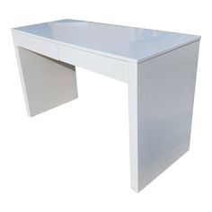 a white desk with drawers on the top