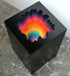 a black box with a rainbow design on it