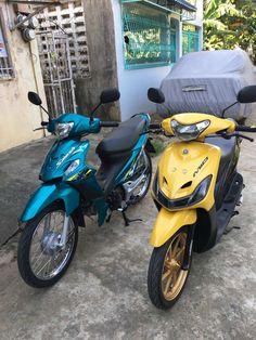 two motorcycles are parked next to each other