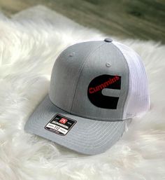 Listing is for a customizable trucker hat. There is a discount if you are purchasing 12 or more hats. If you need quantities over 100 message me for a price quote. Pricing includes digitizing your logo, and the embroidery on the hat. Turn around time can vary depending on current work load but will be between 1-3 weeks. Hat colors are listed, leave your hat color choices in the notes at check out. I will need a high resolution image sent after purchasing the hat. Once it has digitized I will sen Gray Trucker Hat With Embroidered Logo, Gray Trucker Hat With Embroidered Logo And Flat Bill, Gray Trucker Baseball Cap With Flat Bill, Gray Cotton Trucker Hat With Embroidered Logo, Gray Cap With Embroidered Logo, Trucker Hat With Custom Logo And Curved Brim, Trucker Hat With Curved Brim And Custom Logo, Gray Trucker Hat One Size, Trucker Cap With Embroidered Logo