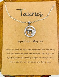 a necklace with the zodiac sign taurus on it