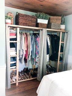 an organized closet with clothes and shoes