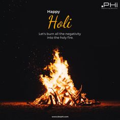 a bonfire with the words happy holi written on it