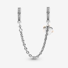 Keep your charms safe and stylish with the Family Heart Safety Chain Charm. This two-tone safety chain charm is hand-finished in sterling silver and 14k rose gold-plated metal. It features two dangling hearts, one warm-toned open heart with an infinity sign and a second heart-shaped sterling silver disc engraved with "Family" on the front. A clip charm on each end includes a line of clear cubic zirconia, finishing off the look in sparkling style. - Pandora Family Heart Safety Chain Charm - Sterl Pandora Family, Bracelet Pandora, Safety Chain, Pandora Bracelet, Pandora Jewelry, 7 And 7, Sterling Silver Charm, High Quality Jewelry, Pandora Charms