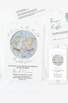 the wedding stationery is laid out on top of each other, including an iphone