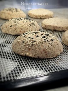 sesame seed cookies on a baking sheet ready to go into the oven in the oven