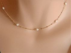 dainty gold choker dainty pearl choker gold rosary choker gold chain choker necklace gold satellite chain gold satellite necklace A beautiful pearl necklace on a satellite chain. Five freshwater pearls and a satellite chain make this necklace of a beautiful and elegant jewel! It can be made on a sterling silver or gold vermeil chain. Please, message me if you want a specific length that is not shown in the menu or if you are not sure of the length. Pearls may have imperfections as they are natur Delicate 14k Gold Filled Choker, Delicate Gold Plated Jewelry With Satellite Chain, Simple Gold Jewelry With Pearl Pendant, Elegant Gold Pearl Necklace With Satellite Chain, Dainty Pearl Choker Jewelry, Dainty Gold Pearl Necklace With Delicate Chain, Simple Pearl Jewelry With Delicate Chain, Dainty Pearl Charm Choker Jewelry, Dainty Gold Plated Pearl Necklace With Delicate Chain