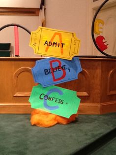 there are signs on top of each other in front of a church pew that says admit, believe, and contes