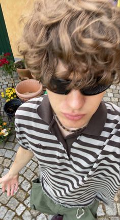 a young man with sunglasses on his face