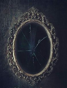 an old mirror with broken glass in it