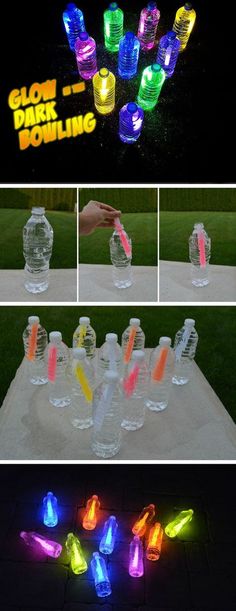 glow in the dark bowling game set up on a table with plastic bottles and neon lights