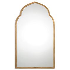 an arched mirror on a white wall