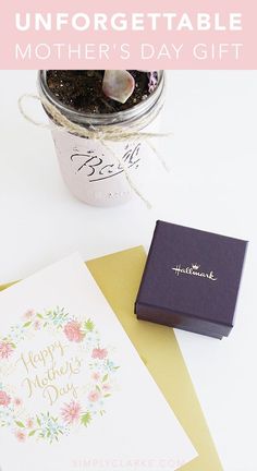 a mother's day gift in a mason jar next to a card and envelope