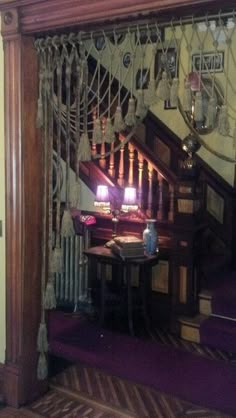 the stairs are decorated with string and lights in this home setting, along with other decor items