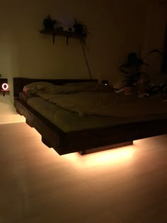 a bed that has some lights on it