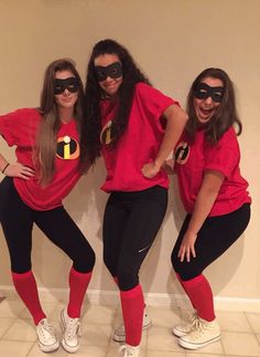 three women in matching costumes posing for the camera with their hands on their hipss