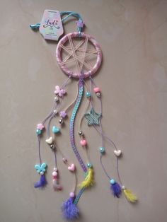 a dream catcher is hanging on the wall