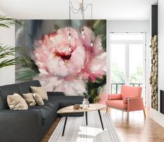 a living room with a large painting on the wall