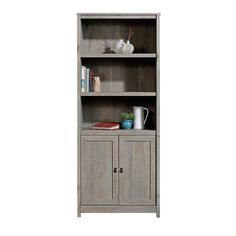 the bookcase has two doors and is made from wood with grey paint on it