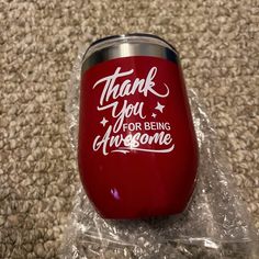 a red wine tumbler with the words thank you for being awesome on it in plastic wrap