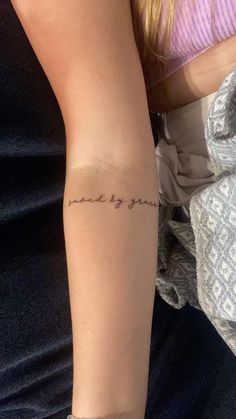 a woman's arm with a tattoo that says, i love you and the words in cursive writing on it