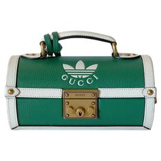 Rare Limited Edition GUCCI x adidas golf ball case handbag or shoulder bag in green and white color ways, with removable and adjustable shoulder strap and push closure / made in Italy New never been used / comes in original box Width: 9 inches / Depth: 4.5 inches / Height: 5 inch 1 available in stock in Italy Order reference #: FABIOLTD G033 Adidas X Gucci, Gucci X Adidas, Mario Testino, Guccio Gucci, Gucci Outfits, Gucci Tote, Color Ways, First Ladies, Adidas Golf