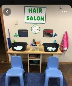 two plastic chairs sitting in front of a table with hair salon items on top of it