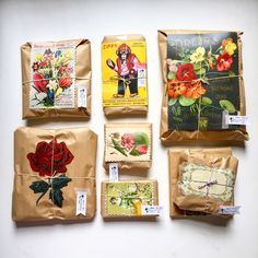 several packages with flowers on them are wrapped in brown paper