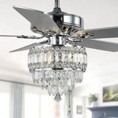 a ceiling fan with crystal chandelier hanging from it