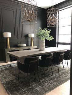 a dining room table with chairs and chandelier