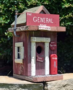 a wooden birdhouse with the words the general on it's roof and door