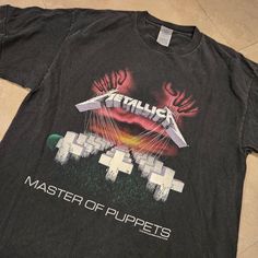 a t - shirt that says metallic master of puppets