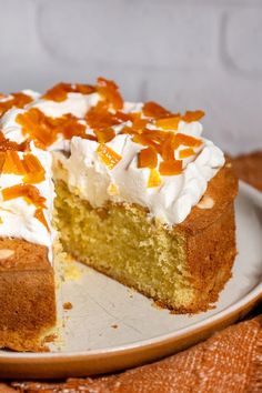 a cake with white frosting and orange toppings