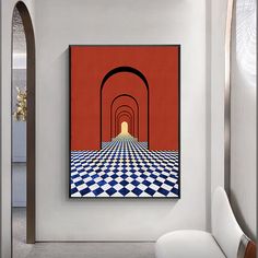 an art piece hanging on the wall above a chair in a room with a checkered floor