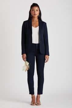 HERES TO STRONG WOMEN... Look sharp with this classic navy suit by The Groomsman Suit. It features a beautifully tailored blazer and tapered pants with a touch of stretch to make a statement on the wedding day.    *Fulfilled by our friends at The Groomsman Suit THE 411 JACKET DETAILS:  Fully-lined with single button front Nonfunctional four-button cuffs  Double side back vent  PANT DETAILS:  Tapered leg with side slit  Split waist construction for easy alteration Zip fly with hidden hook & b Blue Suit Jacket, Suit Jackets For Women, Wear To Work Dress, Navy Blue Suit, Pantsuits For Women, Navy Suit, Casual Suit