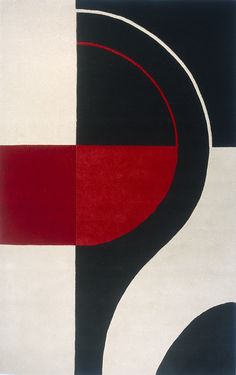 a black, red and white rug with an abstract design on the bottom right corner